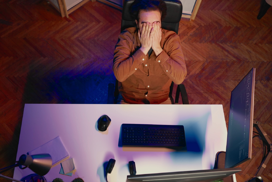 photo of a developer frustrated with his metrics